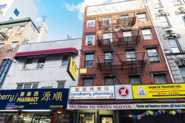 Street with shops and pharmacies in New York City, USA