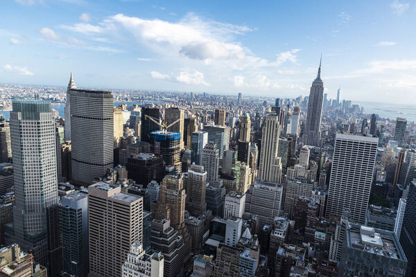 Elevated view of the skyline of modern skyscrapers of Manhattan with the Empire State Building from Top of the Rock in New York City, USA