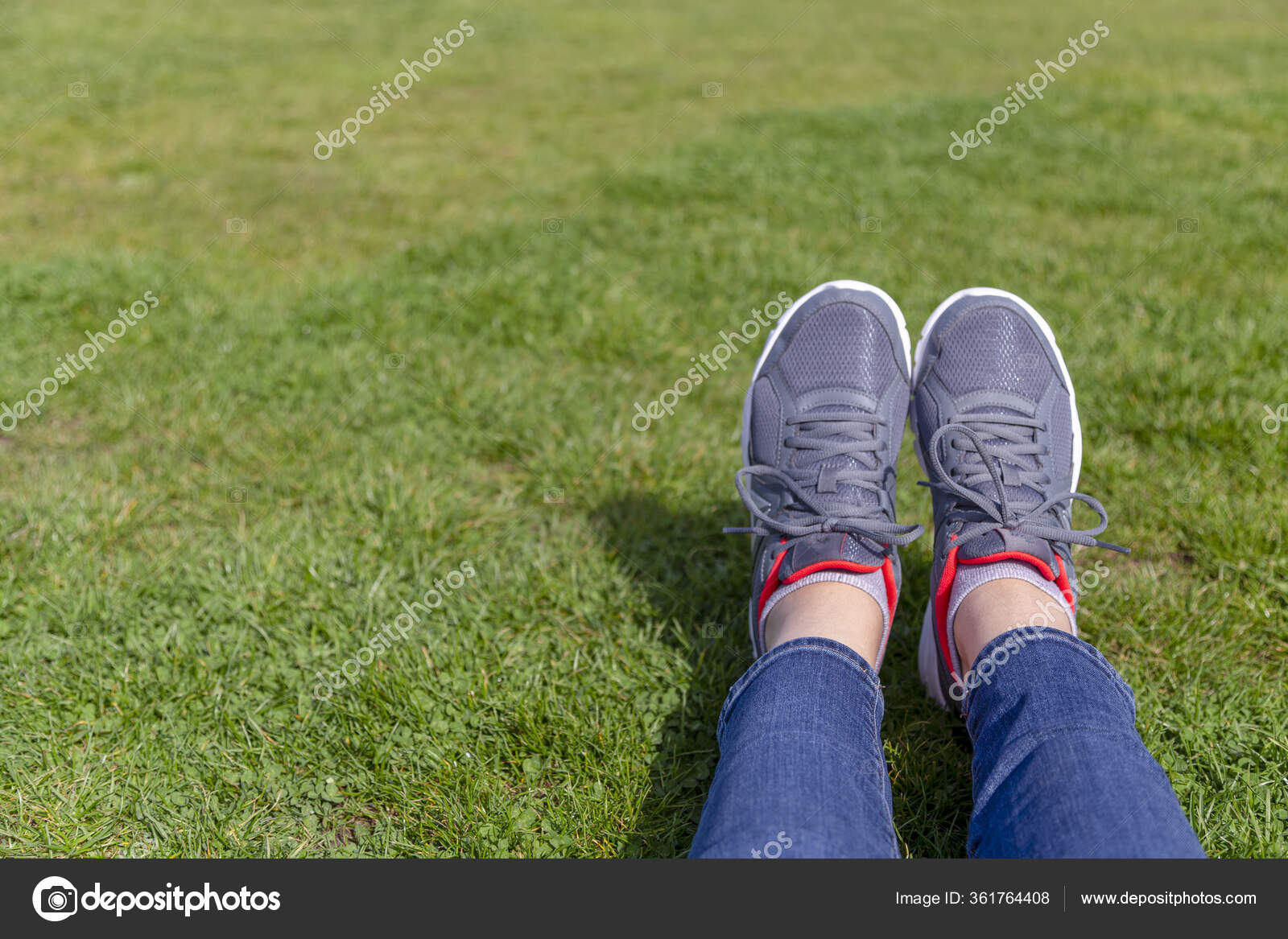 Persons Legs Jeans Grey Trainer Shoes Laying Grass Bright Green Stock Photo  by ©Michelle_Silke 361764408