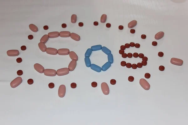 Sos Escrito Pastillas Pastillas Sobre Fondo Blanco — Foto de Stock