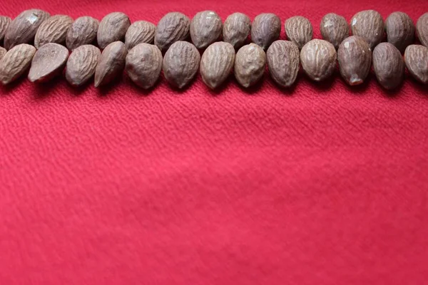 Almonds Lined Line Red Background Almonds Closeup Place Text Nuts — Stock Photo, Image