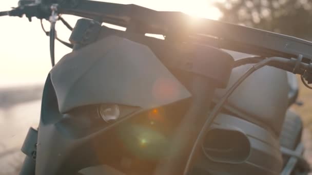 Scary face of a black motorcycle with sunset — Stock Video