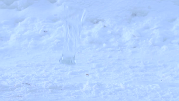 Glass of water falling and Splashing on snow2 — Stock Video