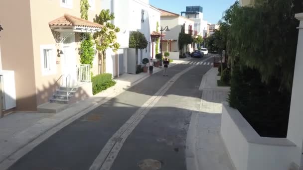 LIMASSOL, CYPRUS - May 4, 2019: view of limassol marina camera movement to decline and drone pilot — ストック動画