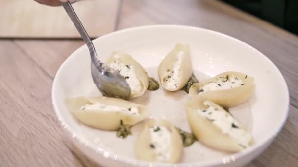 Chef serves a beautiful dish on a plate of Italian ravioli — Stock Video