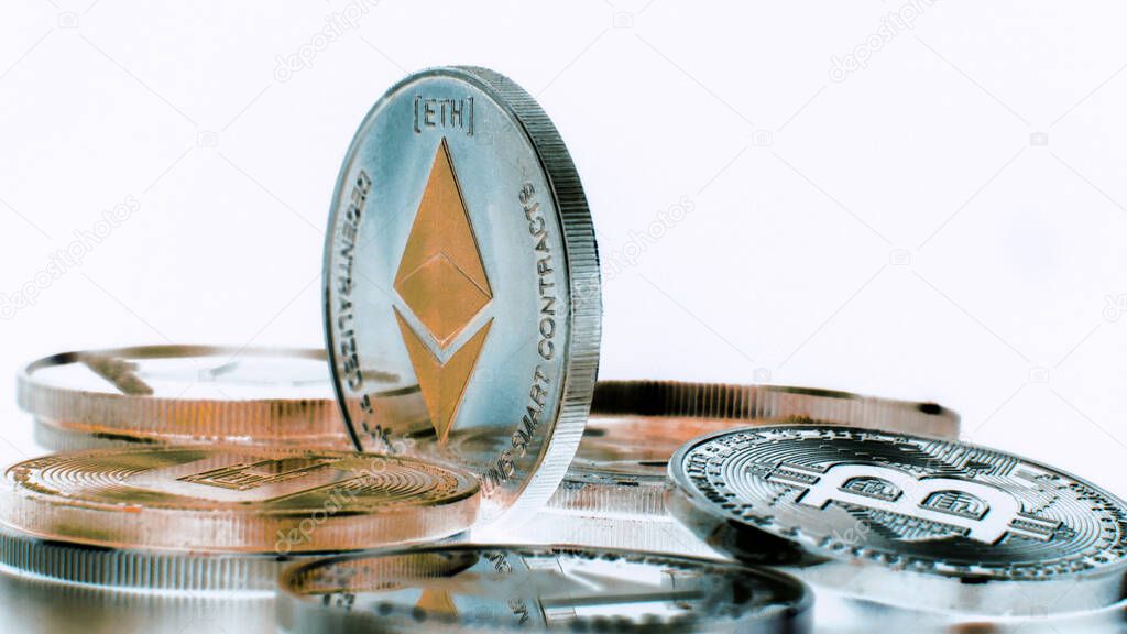 SIlver Ethereum coin on black background. Silver Crypto coin on spinning stand. Inverse