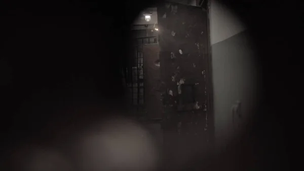 Dark prison corridor through a hole, old walls, scary — Stockfoto