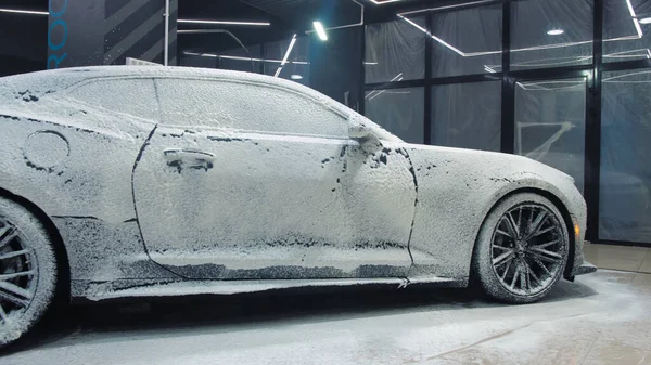 TOMSK, RUSSIA - March 30, 2020: Chevrolet Camaro ZL1 the Exorcist cover the soapy solution — 스톡 사진