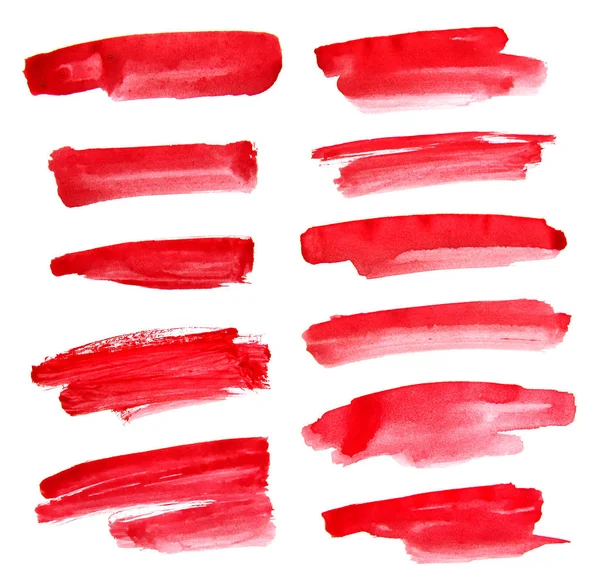 Satz roter Tinte auf weißem Hintergrund — Stockfoto