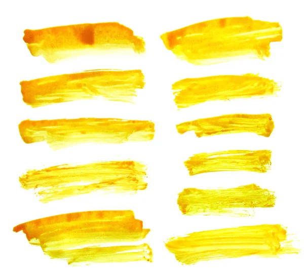 Conjunto de tinta amarela sobre fundo branco — Fotografia de Stock