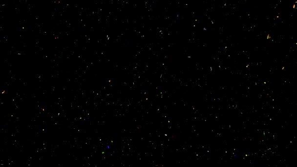 Fond abstrait vidéo au ralenti avec des étincelles brillantes et colorées. Des particules de poussière colorée scintillent. Particules volantes et scintillantes de lumière .