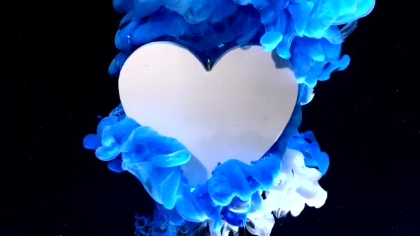 Nagy fehér szív, havas éjszakai háttérrel. Fogantatás Valentin-napra február 14-én. Kék-fehér tinta vízben, fekete alapon.