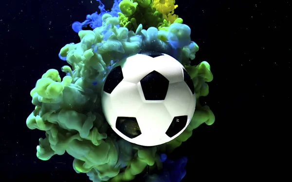 Soccer ball on a fantastic blue and green space background. — 스톡 사진