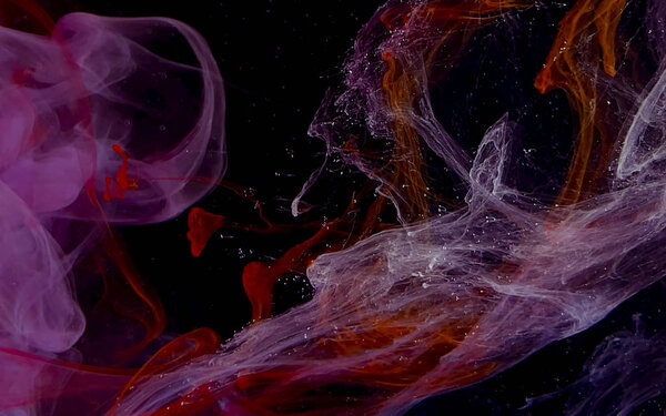 Watercolor ink in water on a black background. Colored space magic background. Digital strings matrix. Abstract background. Cool trending screensaver.