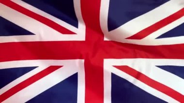 Rüzgarda dalgalanan Uk bayrağı. İngiliz bayrağı yaklaşıyor.