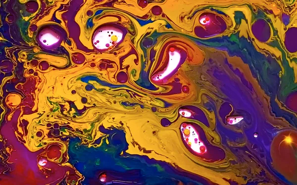 Multi-colored watercolor ink in water and oil. Amazing futuristic background. Planets, the universe and space. Abstract background. Cool trending screensaver.
