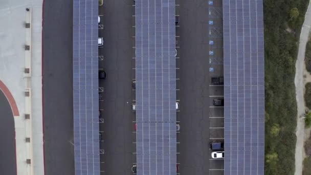Solar panels in parking lot, aerial birds eye panning, Los Angeles, California — Stock Video