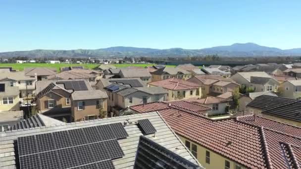 Houses with solar panels on roof in luxury suburb, rising aerial reveal — Stock Video