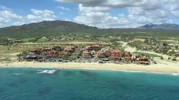 Aerial, hyper lapse, over the ocean, towards hotels and resorts, Cabo, Mexico — Stock Video