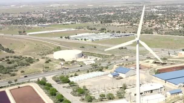 Wind Turbine, Drone Aerial View of Spinning Blades and Traffic — Stock video