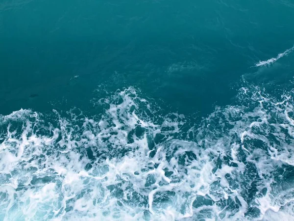 stock image splashing waves of sea water with white ripples