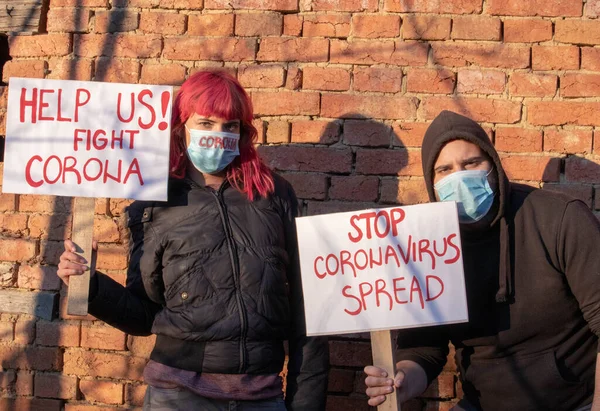 Young people protest for Corona virus. Coronavirus pandemic global panic.