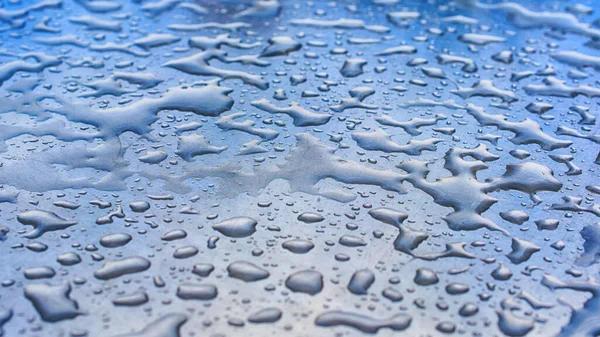 water drops on smooth surface in perspective, macro