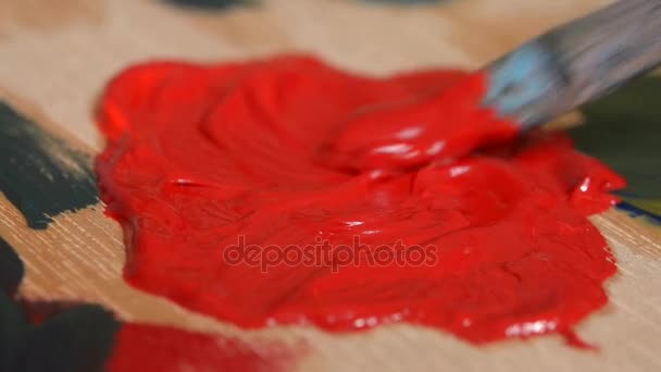 Paint red are mixed with a brush — Stock Video