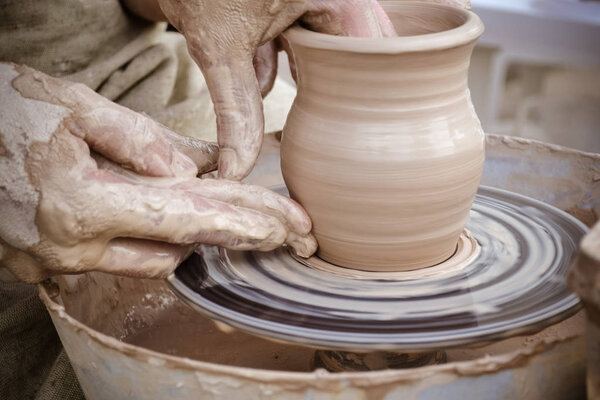 Master class on modeling of clay on a potter's wheel