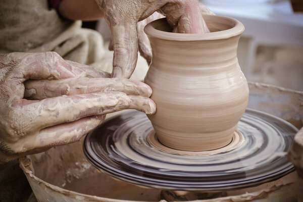Master class on modeling of clay on a potter's wheel