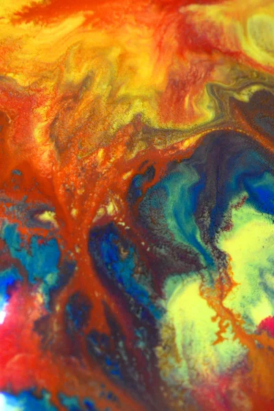 Red, green, blue, yellow colors mixed fluid macro — Stock Photo, Image