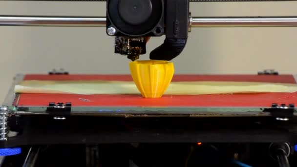 3D printer builds up the object yellow color close-up — Stock Video