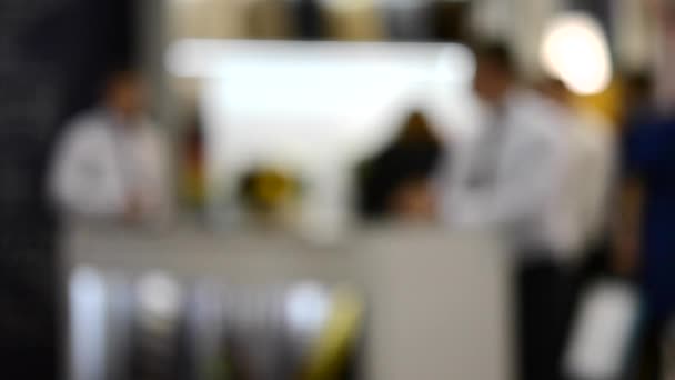 Men businessmen in business suits behind a white table inside a building — Stock Video