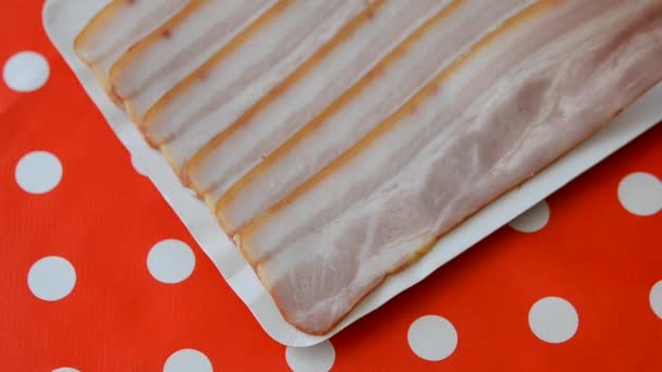 Person taking slices of bacon. Close-up top view. — Stock Video