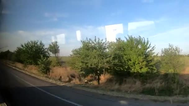 Vista da janela de um ônibus em movimento — Vídeo de Stock