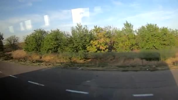 Vista da janela de um ônibus em movimento — Vídeo de Stock