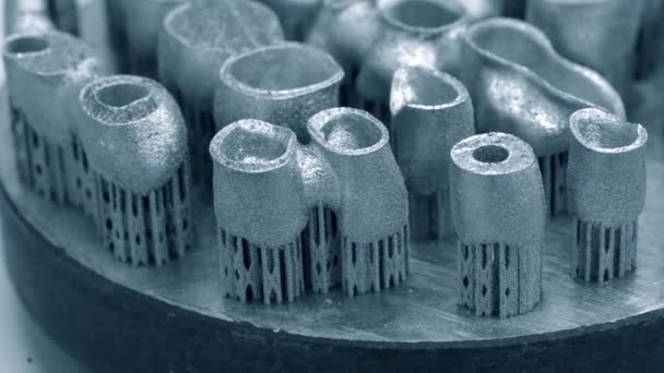 Dental crowns created in a laser sintering machine close-up. DMLS, SLM — 비디오