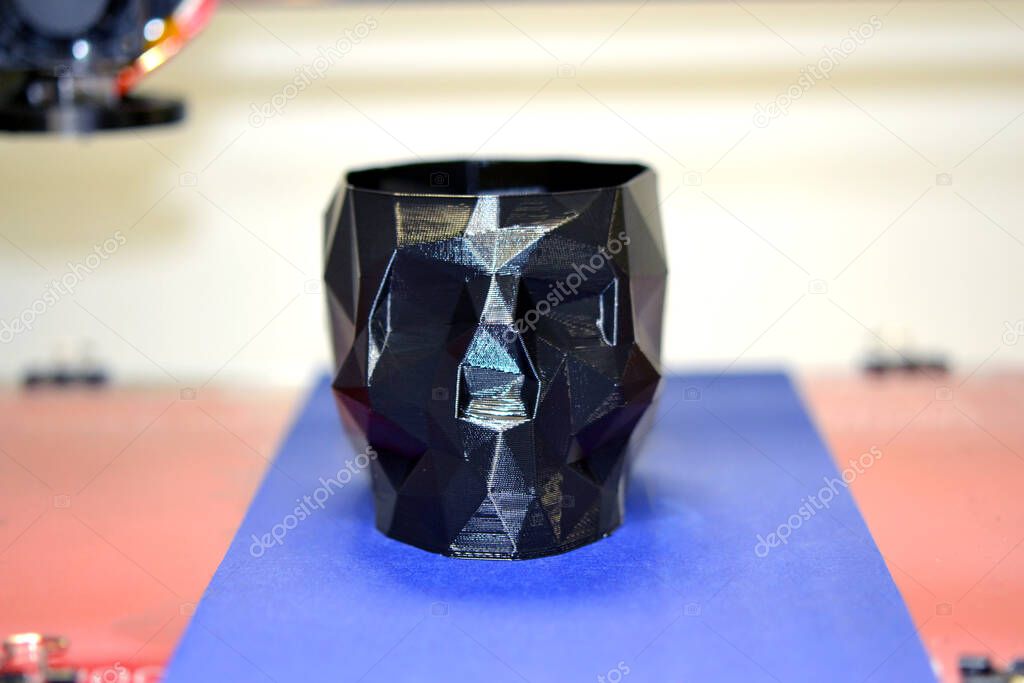Abstract object of a black color printed by 3d printer.