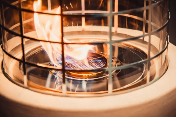 Modern bio fireplot fireplace on ethanol gas. Flame gas stove close-up.