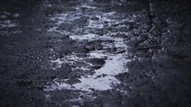 Heavy rain shower downpour cloudburst rainfall behind the glass.