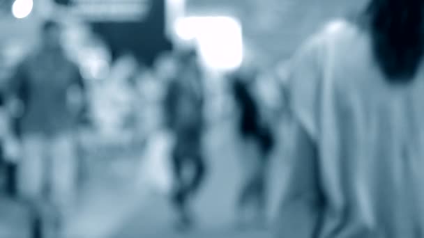 Many people walk inside the mall exhibition store. Blurred Background — Stock Video