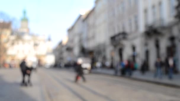 Abstract Defocused Blurred Background of many people on street square — Stock Video