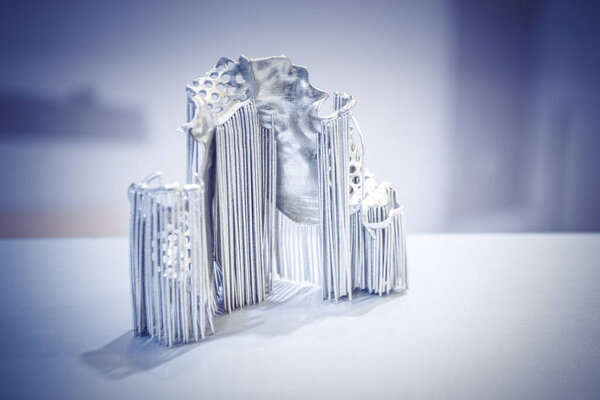 Dental crowns printed in laser sintering machine. Modern 3D printer