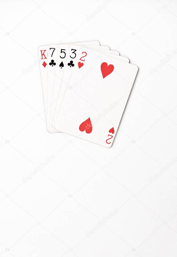 Poker hand ranking, symbol set Playing cards in casino: hight hand, King, seven, five, three, two on white background, luck abstract, vertical copyspace