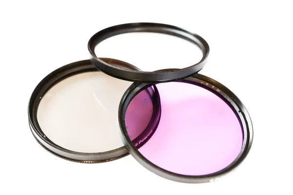 Filtro de lentes polarizantes, protectores y fluorescentes aislado sobre fondo blanco, foto abstracta —  Fotos de Stock