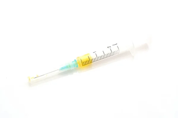 Syringe with yellow liquid on white background. Good photo for your store internet. — Stock Photo, Image