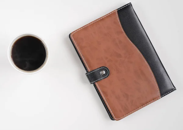 Xícara de café e caderno em branco — Fotografia de Stock