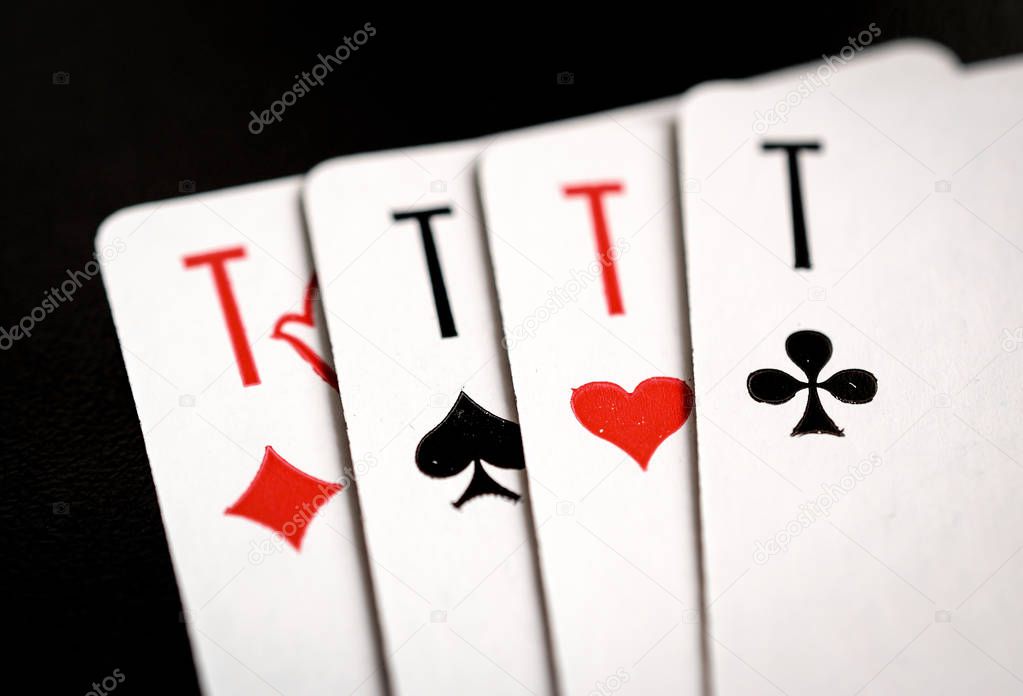 four aces on the black background, playing cards