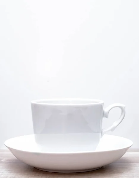 Šálek na kávu na bílém pozadí — Stock fotografie