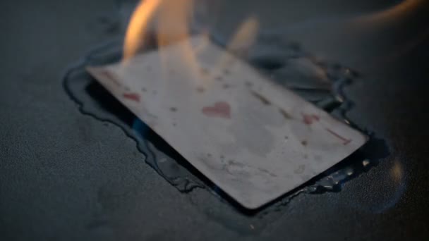 Abstract ace of hearts burns on black background hd slow motion footage for you ideas — Stock Video